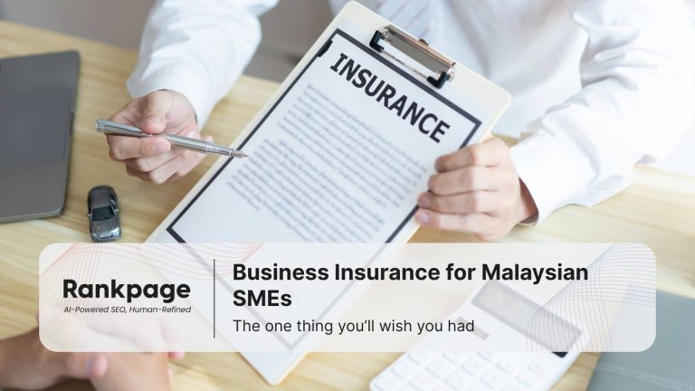 Agent showing business insurance document to client protection options for Malaysian SMEs