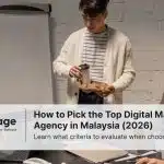Three colleagues in a digital marketing agency sit around discussing a project