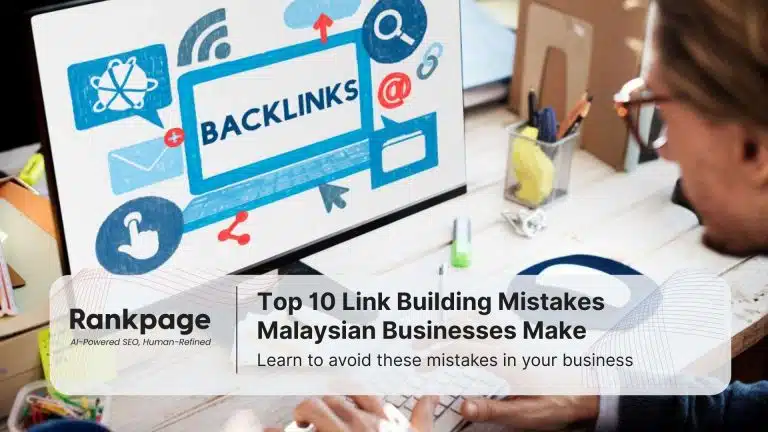 A man types on a computer which has a picture with the word 'backlinks' on the screen. He is doing link building for his company.