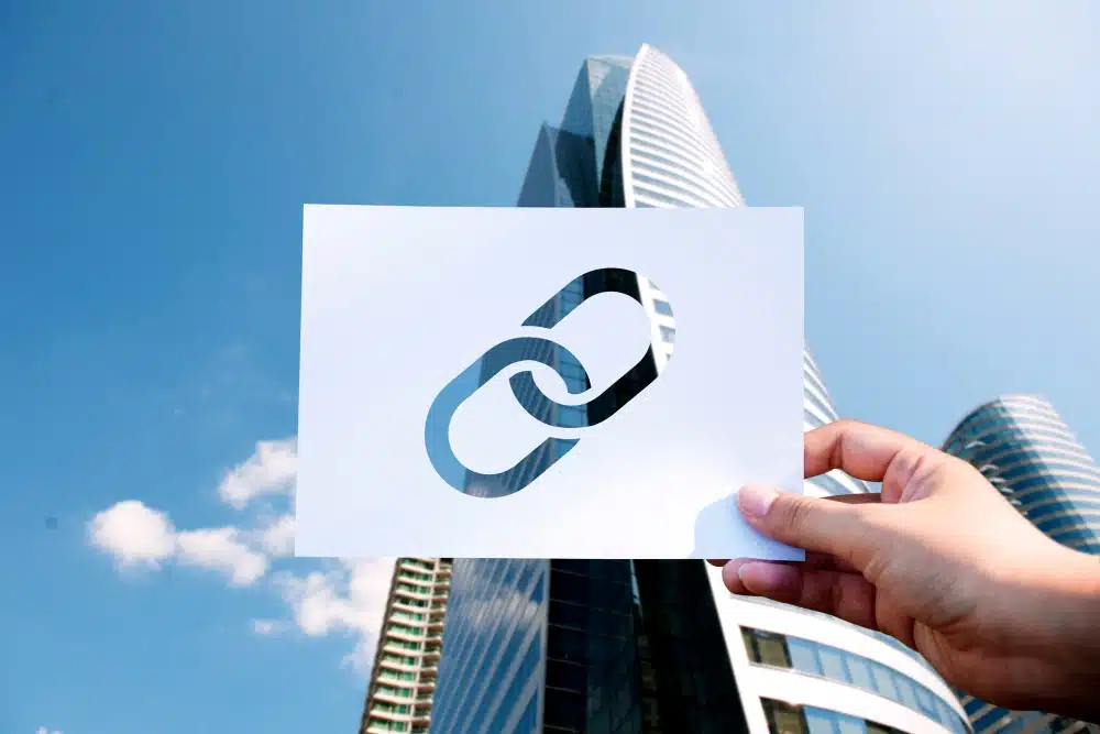 Link symbol against a blue sky and tower in the background