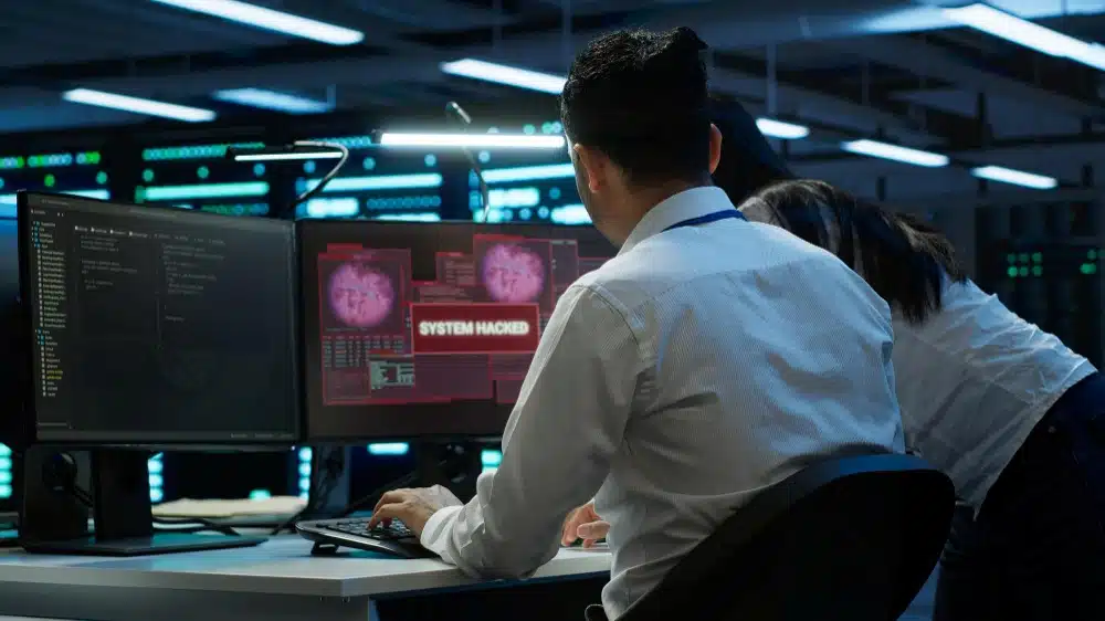 A cybersecurity expert working on a hacked system