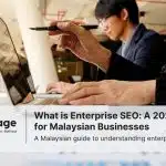 A photo of an office, with one worker conducting enterprise SEO.
