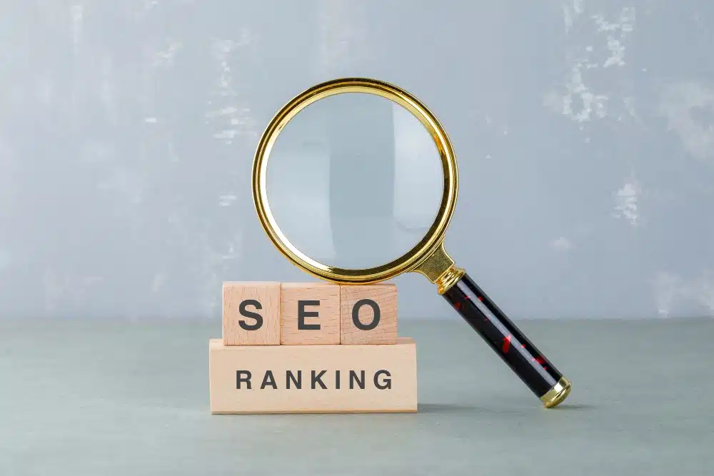 Hourglass resting on wooden blocks that spell out 'SEO Ranking'