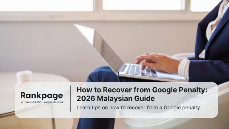 A businessman types on his laptop, learning how to recover from Google penalty.