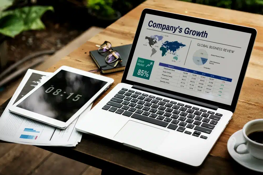 Laptop with a powerpoint slide discussing global business on the screen