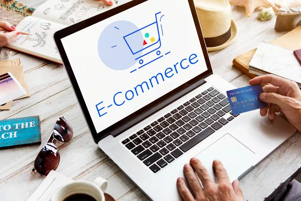 Photo of a laptop with the word 'ecommerce' on the screen