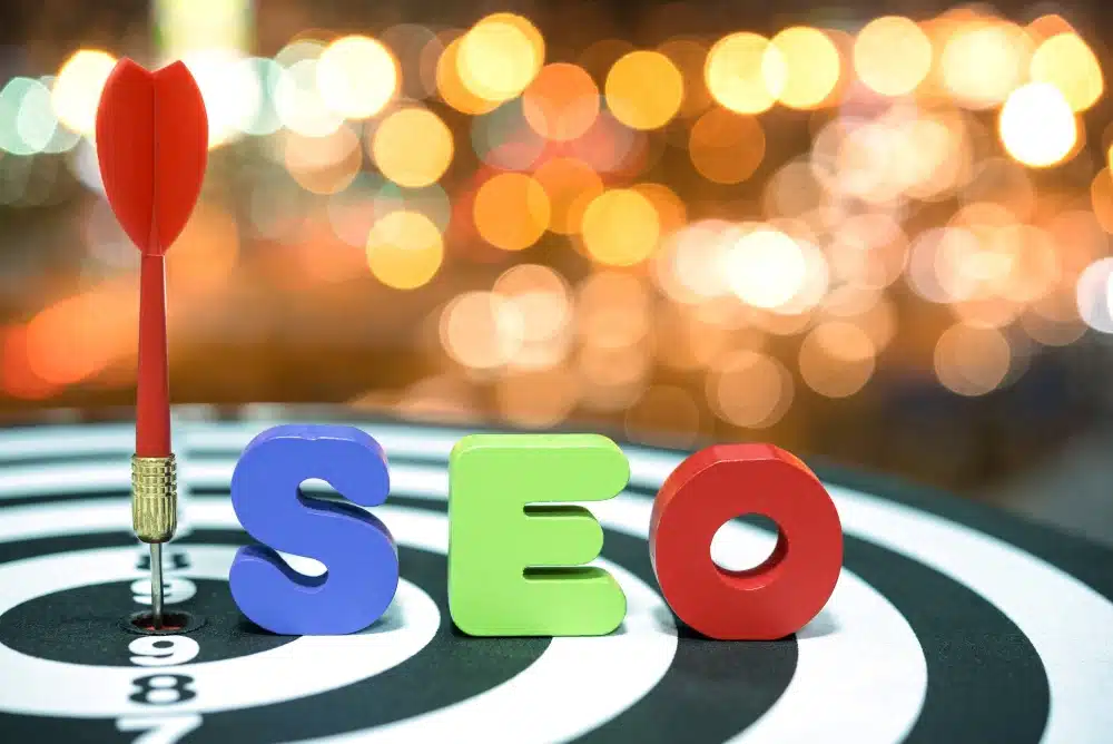 A dartboard, dart, and the word 'SEO' on it.