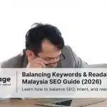 A stressed man stares at his laptop, analyzing the keywords on his site