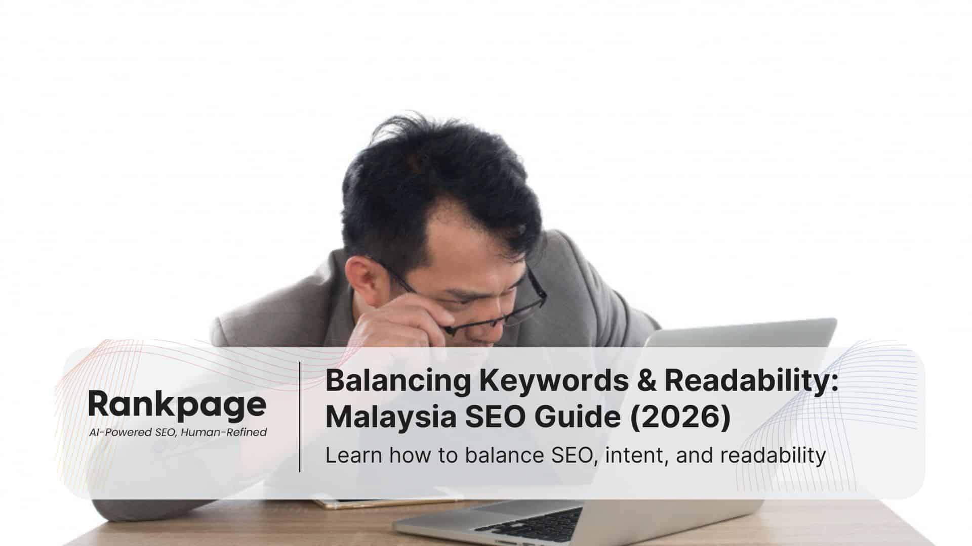 A stressed man stares at his laptop, analyzing the keywords on his site