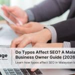 Two businesspeople typing on their laptops as they engage in Malaysia SEO