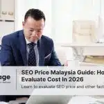 A businessman stares at some documents on his laptop, considering the SEO price of a company he wants to hire.
