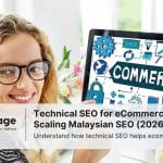 A woman smiles at the camera, while working on a PC that has the word 'commerce' on the screen, representing technical SEO for ecommerce