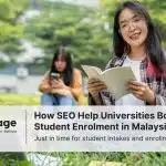 Two university students sitting on the grass and happy