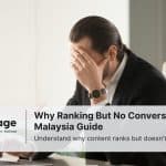 A stressed-out businessman sits in his office worrying about why his site is ranking but not converting users.