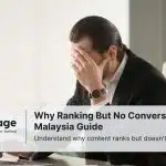 A stressed-out businessman sits in his office worrying about why his site is ranking but not converting users.