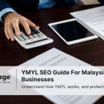Photo of a man at a desk calculating something with legal documents sitting by him. This represents YMYL SEO